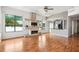 Spacious living room featuring a stone fireplace, wet bar, and ample natural light at 3127 W Sligh Ave # 204B, Tampa, FL 33614