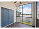 Screened in porch with closet offering a beautiful lake view to enjoy the outdoors and stay shaded at 3127 W Sligh Ave # 204B, Tampa, FL 33614