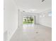 Bright living room with sliding glass doors leading to the backyard at 6228 Golden Beach Dr, Apollo Beach, FL 33572