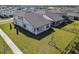 An aerial view of a home with lush green lawn and a fenced yard in a neighborhood at 6240 Golden Beach Dr, Apollo Beach, FL 33572