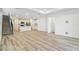 Spacious living room features a staircase and direct access to the modern kitchen at 6240 Golden Beach Dr, Apollo Beach, FL 33572