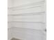 Organized shelving system in the walk-in closet provides ample storage options and functionality at 6240 Golden Beach Dr, Apollo Beach, FL 33572
