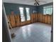 Under renovation: Bedroom with new tile floor and painted walls at 6413 Harbor Dr, Hudson, FL 34667