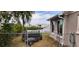 View of the side yard with a chain link fence and a trailer at 6413 Harbor Dr, Hudson, FL 34667