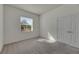 Simple bedroom with neutral wall colors and carpet flooring at 6419 Blue Sail Ln, Apollo Beach, FL 33572