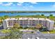 Waterfront building with parking and lush landscaping at 6251 Shoreline Dr # 2102, St Petersburg, FL 33708