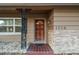 Front entry with brick facade and decorative columns at 1756 Ashton Abbey Rd, Clearwater, FL 33755