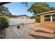 Relaxing brick patio with table and chairs, perfect for outdoor entertaining at 1756 Ashton Abbey Rd, Clearwater, FL 33755