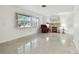 Bright living room with fireplace and terrazzo flooring at 1756 Ashton Abbey Rd, Clearwater, FL 33755