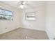 Simple bedroom with ceiling fan and window at 1756 Ashton Abbey Rd, Clearwater, FL 33755