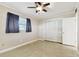 Spacious bedroom featuring a ceiling fan and large closet at 1756 Ashton Abbey Rd, Clearwater, FL 33755