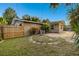 Landscaped backyard with stone pathway and wooden fence at 1756 Ashton Abbey Rd, Clearwater, FL 33755