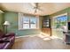 Green living room with wood floor and built-in hutch at 1756 Ashton Abbey Rd, Clearwater, FL 33755