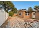 Spacious backyard patio with a seating area and adjacent building at 1756 Ashton Abbey Rd, Clearwater, FL 33755