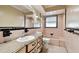 Bathroom with pink tile, vintage vanity, and shower/tub combo at 1756 Ashton Abbey Rd, Clearwater, FL 33755