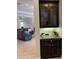 Kitchen wet bar features dark wood cabinetry, granite countertop, and wine rack at 16015 Cape Coral Dr, Wimauma, FL 33598