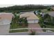One-story home with three-car garage, situated near a lake at 16015 Cape Coral Dr, Wimauma, FL 33598