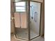 Bathroom with a large shower, built-in seat, and grab bar at 16015 Cape Coral Dr, Wimauma, FL 33598