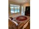 Living area showcasing pool and lake views at 16015 Cape Coral Dr, Wimauma, FL 33598