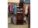 Large walk-in closet with custom shelving and drawers at 16015 Cape Coral Dr, Wimauma, FL 33598