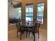 Charming breakfast nook with a glass-top table and pool views at 16015 Cape Coral Dr, Wimauma, FL 33598