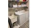 Spacious laundry room with washer, dryer, and ample storage at 16015 Cape Coral Dr, Wimauma, FL 33598