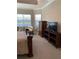 Main bedroom with large bed and seating area at 16015 Cape Coral Dr, Wimauma, FL 33598