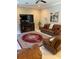Relaxing living room featuring leather furniture and a fireplace at 16015 Cape Coral Dr, Wimauma, FL 33598