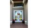 Double front doors with glass panels and fall decor at 16015 Cape Coral Dr, Wimauma, FL 33598