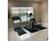 Home gym with treadmill, elliptical and stationary bike at 16015 Cape Coral Dr, Wimauma, FL 33598