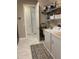 Laundry room with washer, dryer, shelving, and utility sink at 16015 Cape Coral Dr, Wimauma, FL 33598