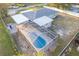 An aerial view of a home with a screened-in pool in the backyard at 10112 Midway St, Gibsonton, FL 33534