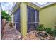 Screened-in patio with paver stones and a small fountain at 524 Winterside Dr, Apollo Beach, FL 33572