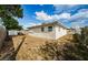 Backyard view showing a shed and a fenced yard at 1551 Derrick St, Holiday, FL 34690