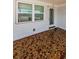 Covered porch with terracotta tile flooring at 1551 Derrick St, Holiday, FL 34690