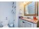 Clean bathroom with granite vanity and updated fixtures at 1551 Derrick St, Holiday, FL 34690