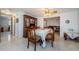 Spacious dining area with wood table and chairs near kitchen at 1551 Derrick St, Holiday, FL 34690