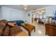 Spacious living room with a view into the dining area at 1551 Derrick St, Holiday, FL 34690