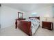 Bright bedroom with wood bed frame and tiled floors at 1551 Derrick St, Holiday, FL 34690