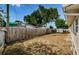 Large fenced backyard with a playset visible at 1551 Derrick St, Holiday, FL 34690