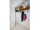 Functional closet with hanging rod and shelving at 1551 Derrick St, Holiday, FL 34690