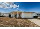 Mid-century ranch home with carport and landscaping at 1551 Derrick St, Holiday, FL 34690