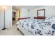 Bedroom with a double bed, dresser, and view of hallway at 1551 Derrick St, Holiday, FL 34690