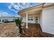 Covered porch with terracotta tile flooring at 1551 Derrick St, Holiday, FL 34690