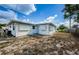 House exterior with backyard and white siding at 1551 Derrick St, Holiday, FL 34690