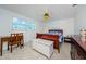 Spacious bedroom with double bed, desk, and ceiling fan at 1551 Derrick St, Holiday, FL 34690
