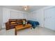 Simple bedroom with brown leather couch and window blinds at 1551 Derrick St, Holiday, FL 34690