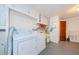 Laundry room with washer, dryer, and storage at 1551 Derrick St, Holiday, FL 34690