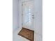 Front door with leaded glass design at 1551 Derrick St, Holiday, FL 34690