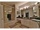 Bathroom with double vanity, granite countertops and a bathtub at 2757 Via Cipriani # 1132A, Clearwater, FL 33764